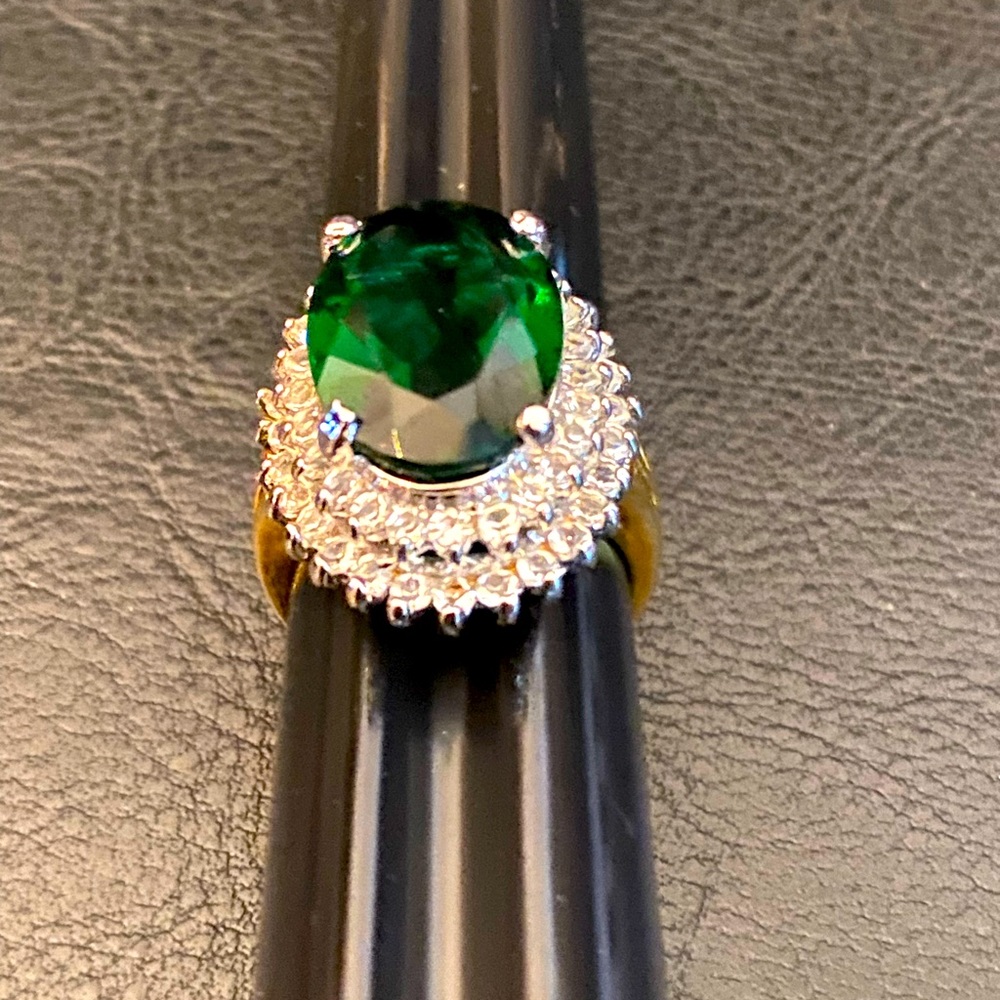 Green oval and diamond ring